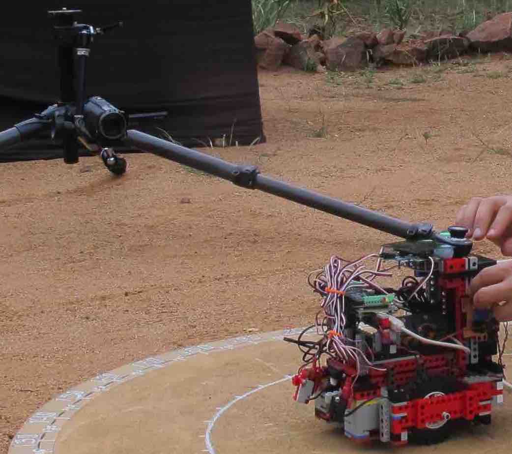 The robot, outside in South Africa, posing for a camera.